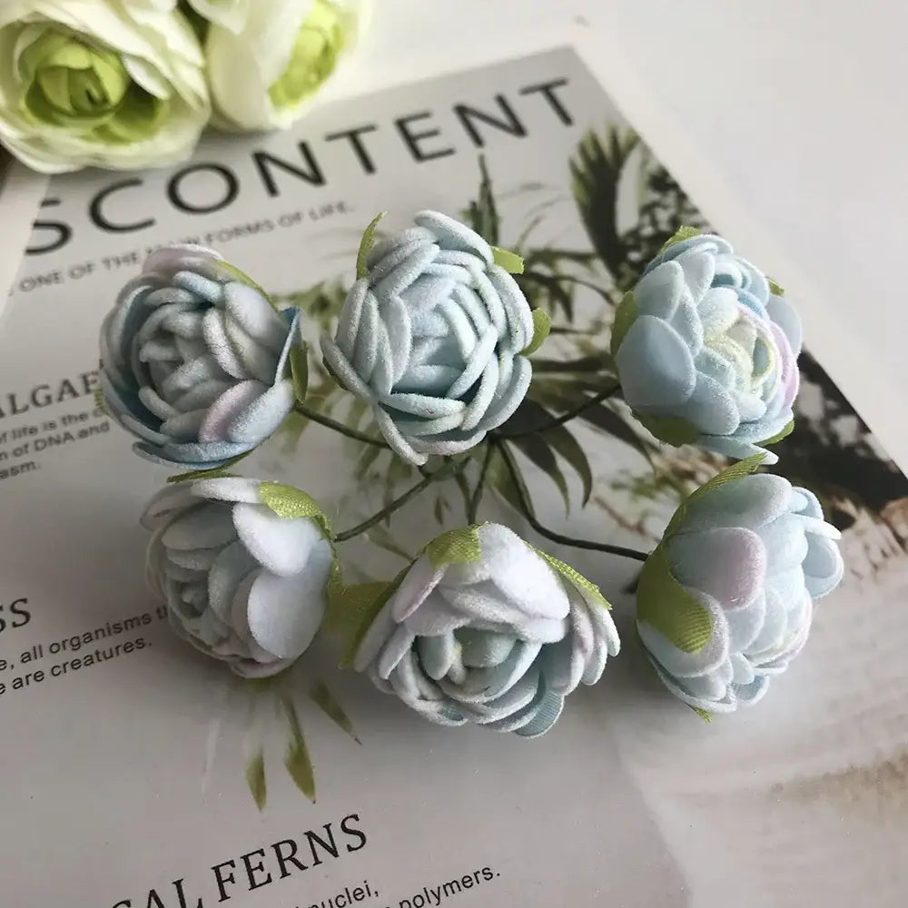 Delicate blue flower stamen berries bundle with light blue and white fabric flowers and green stems for kitchen cake decor