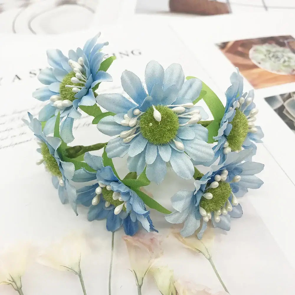 A delicate blue flower stamen berries bundle with green centers and white bead accents for kitchen cake decor
