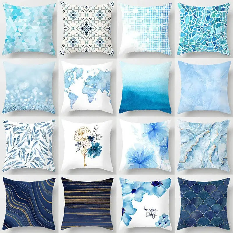A collection of blue geometric marble throw pillows with various patterns including maps and floral motifs for living room decor