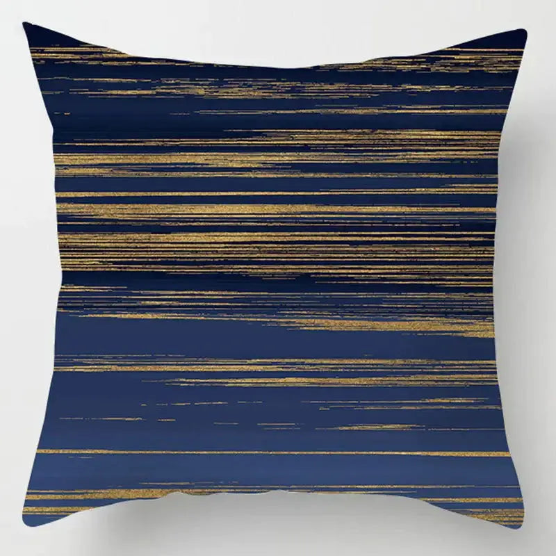 A navy blue geometric marble throw pillow with horizontal gold brushstroke stripes for decorbites blue geometric decor