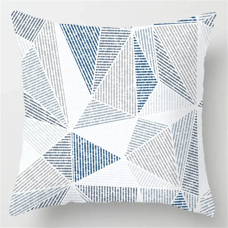 Square throw pillow with blue geometric marble pattern of interlocking triangles in blue gray and white for living room decorbites decor