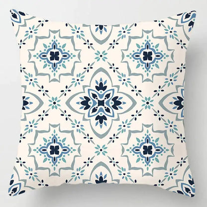 Square cream throw pillow with blue geometric marble pattern and stylized floral motifs for decorbites blue geometric decor