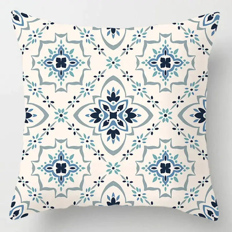 Square cream throw pillow with blue geometric marble pattern and stylized floral motifs for decorbites blue geometric decor