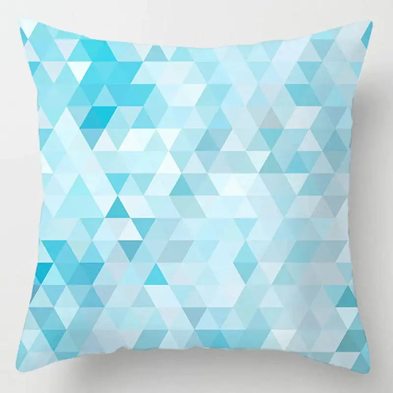Blue geometric marble throw pillow with interlocking triangles pattern in shades of blue and white for living room decorbites decor
