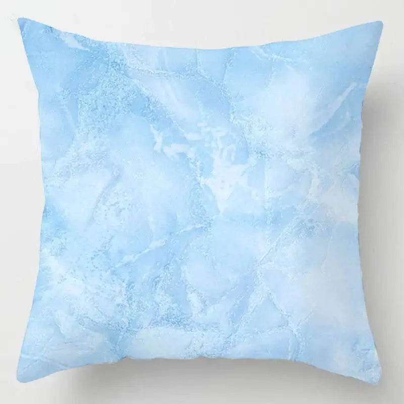 A square throw pillow with a soft icy blue geometric marble stripe pattern for decorbites blue geometric living room decor