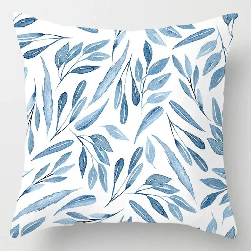 White throw pillow with blue leaves pattern complementing decorbites blue geometric marble living room decor