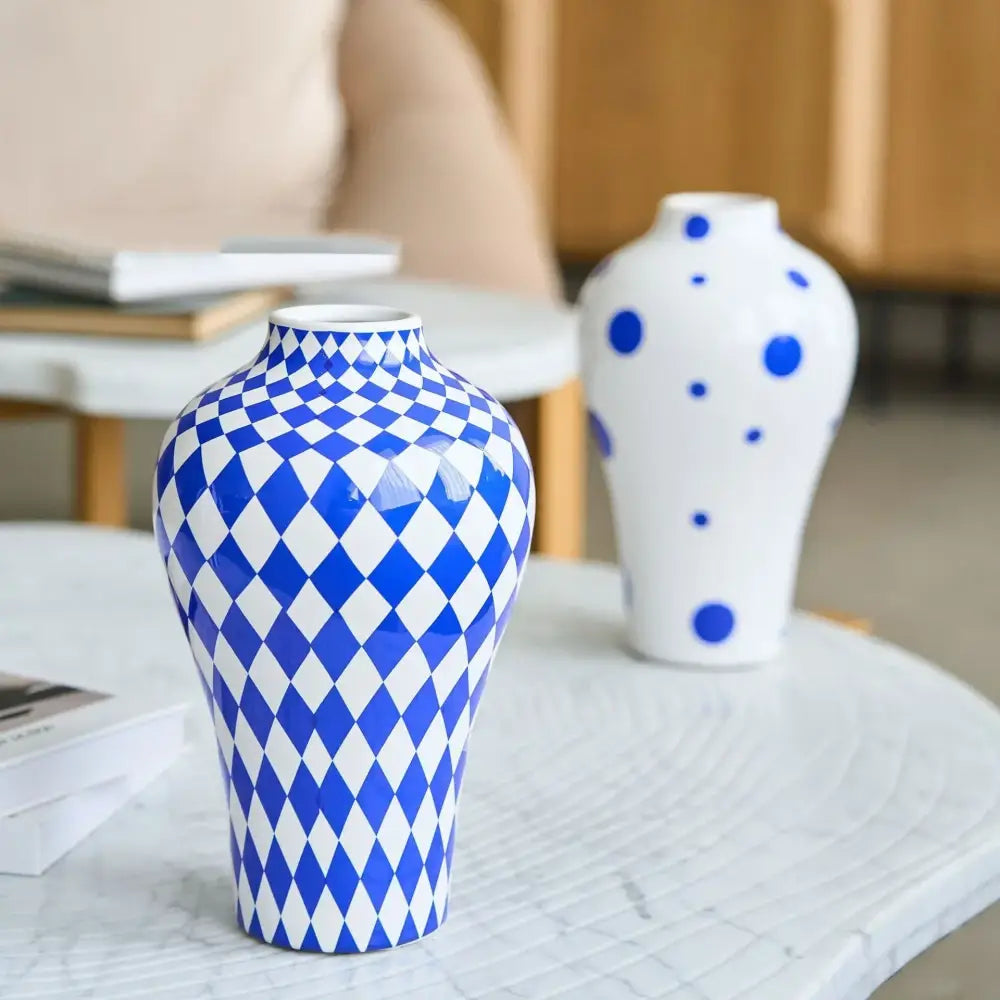 Glossy blue and white geometric quilted ceramic vase with bold diamond pattern for decorbites blue geometric decor