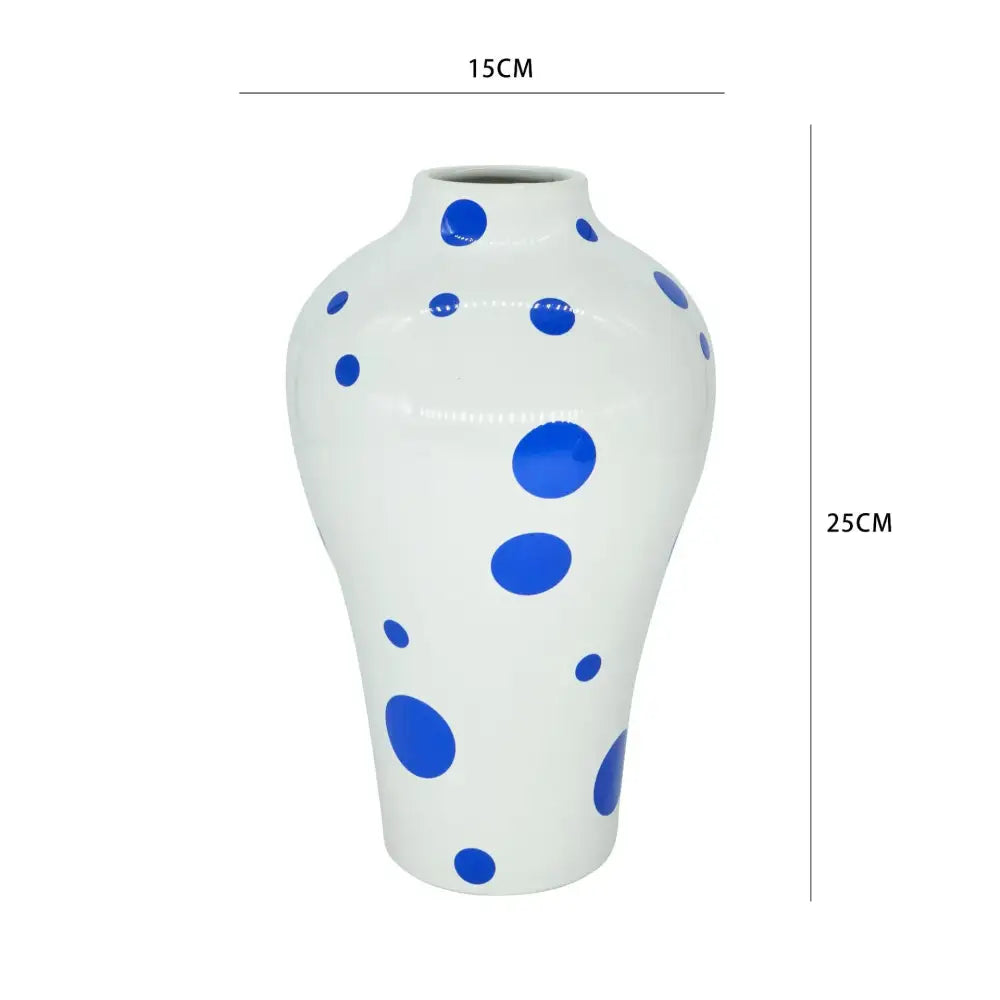 White ceramic vase with glossy finish and blue polka dots from decorbites blue geometric quilted ceramic set for living room decor