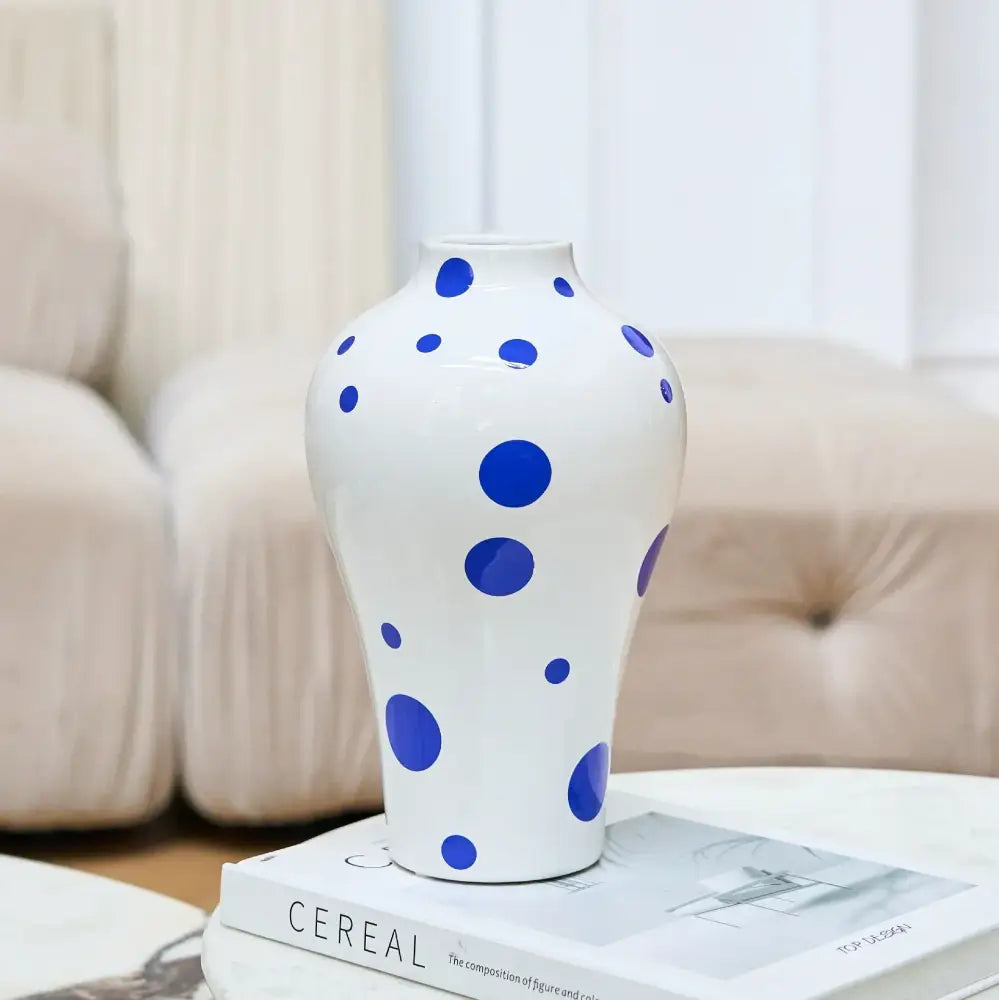 White ceramic vase with bold blue polka dots from decorbites blue geometric quilted ceramic living room decor set