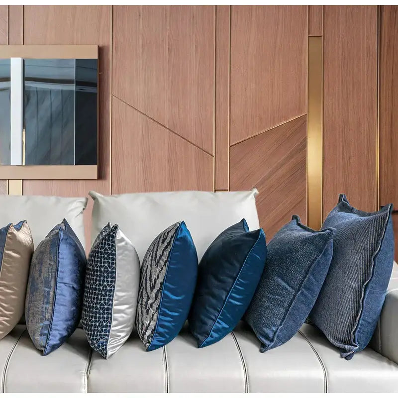A collection of decorbites blue geometry jacquard pillow covers in blue silver and gold satin and velvet for living room decor