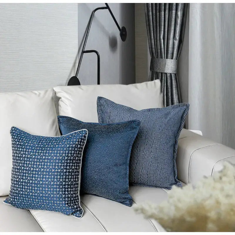 Three blue geometry jacquard pillow covers with textured patterns on a white sofa for decorbites pillow cover decor