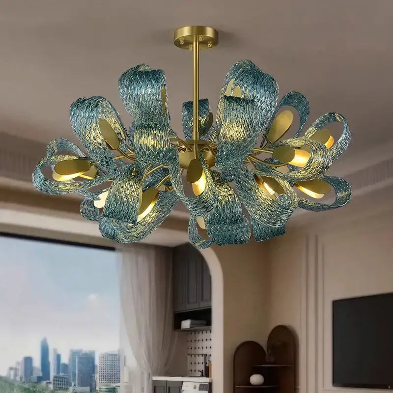 A modern blue glass flower ceiling chandelier with teal-blue petals and gold metal accents for dining room decorbites blue glass