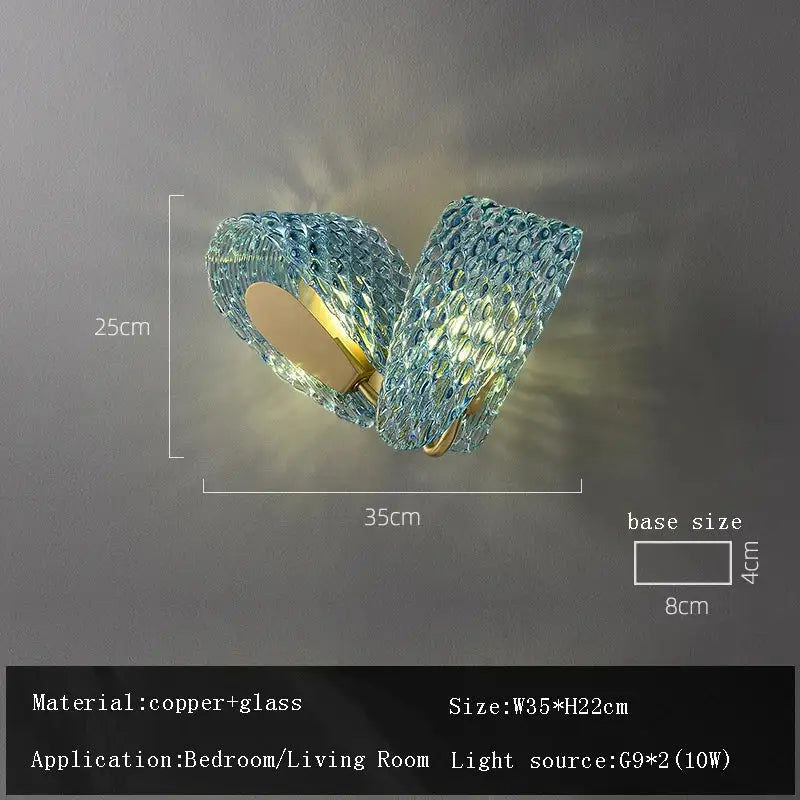 Blue textured glass wall sconce with copper accents complementing decorbites blue glass flower ceiling chandelier for dining room