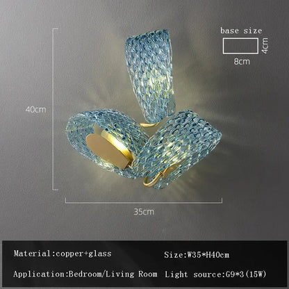 Blue textured glass wall sconce with copper accents complementing decorbites blue glass flower ceiling chandelier