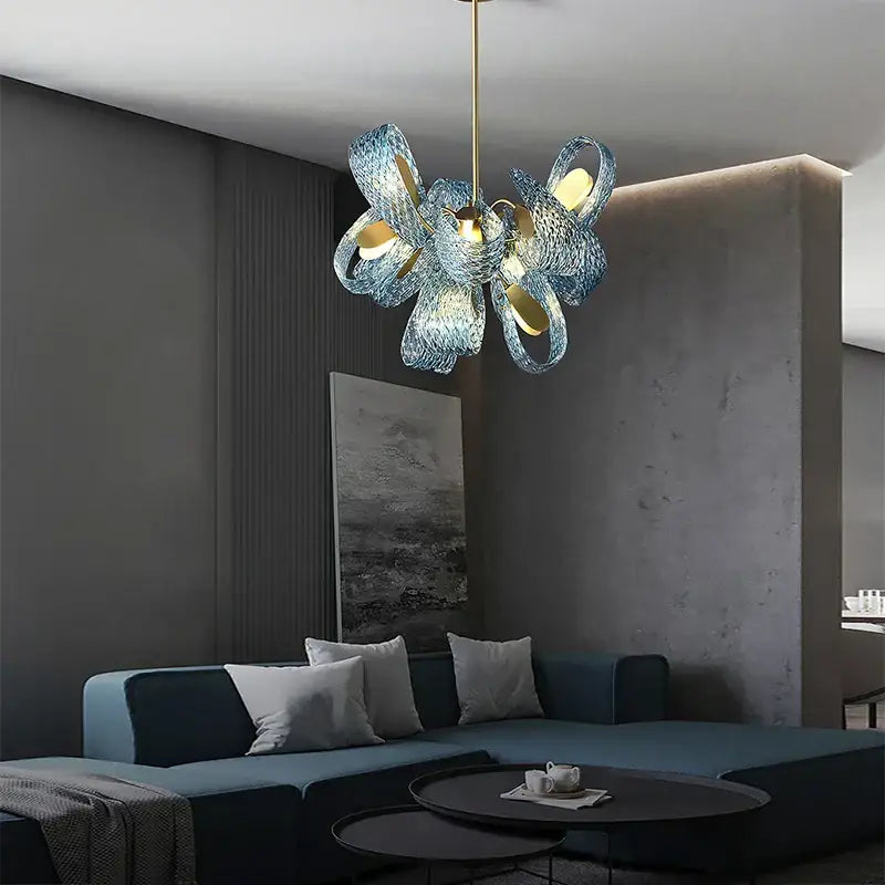 Blue glass flower ceiling chandelier with woven petal design and gold-toned accents for dining room decorbites blue glass