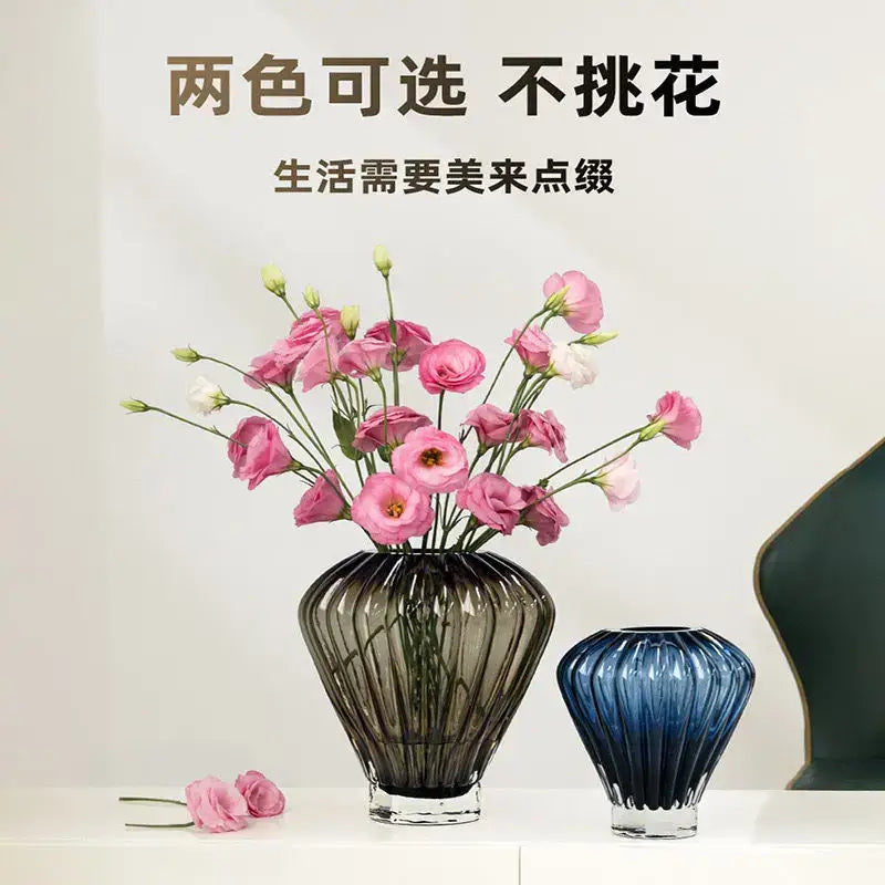A sleek dark gray ribbed glass vase with transparent base inspired by hot air balloon decor for living room use