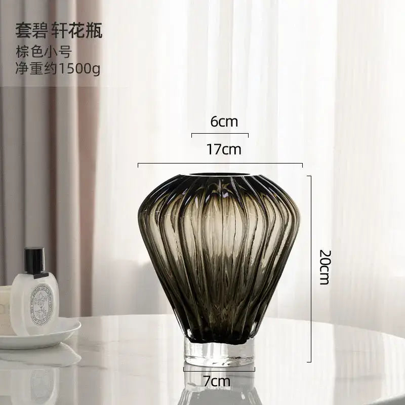 A sleek brown-tinted glass hot air balloon vase with fluted ribbed design and clear base for living room decor