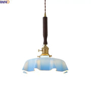 Blue glass led pendant lamp with brass fixture and dark wooden handle for dining room decorbites blue glass lighting