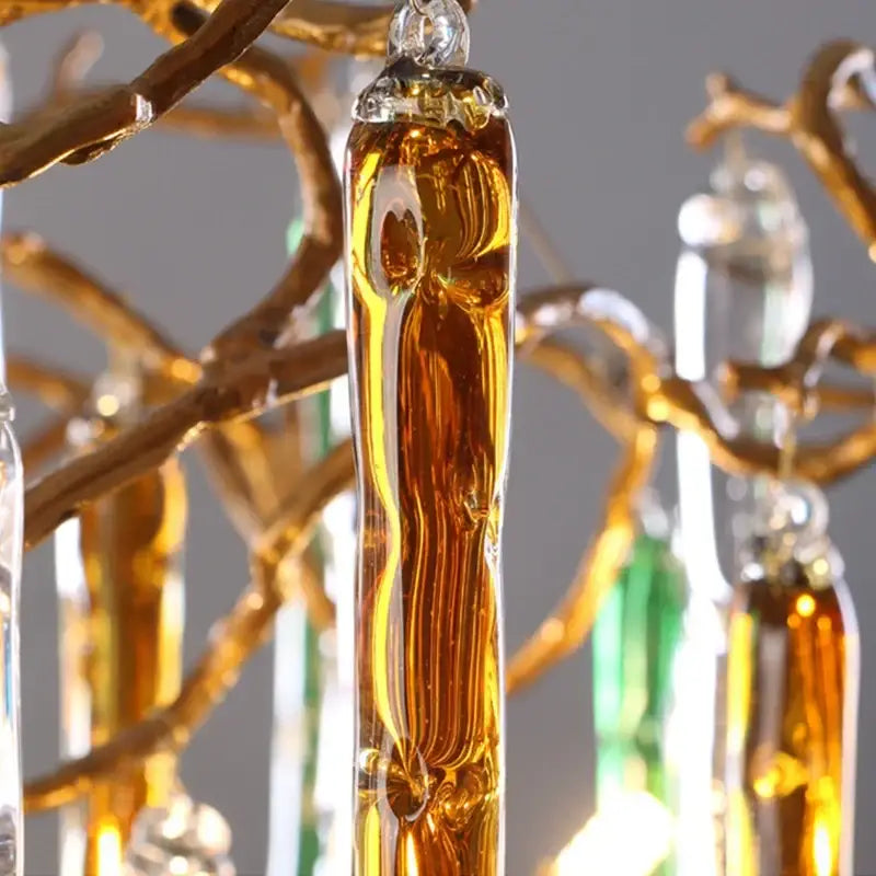 Amber-colored glass decorbites crystal pendant chandelier with intricate flowing design and clear crystal cap for stairwell light
