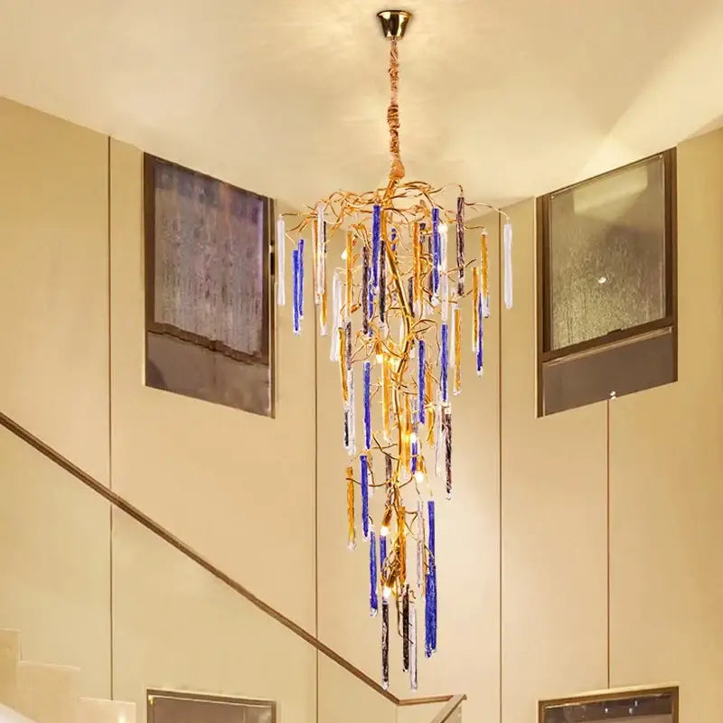 Golden crystal pendant chandelier with cascading blue and clear glass rods by decorbites for stairwell lighting decorbites crystal pendant