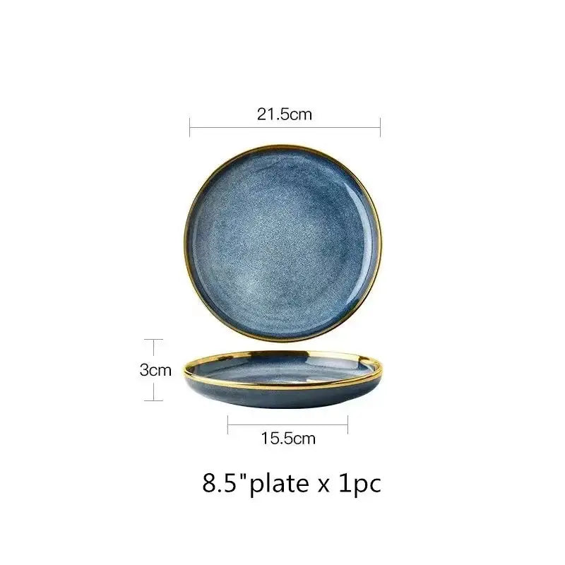 A sleek 8.5-inch ceramic plate with blue gradient glaze and gold rim from a ceramic plate set for dining use