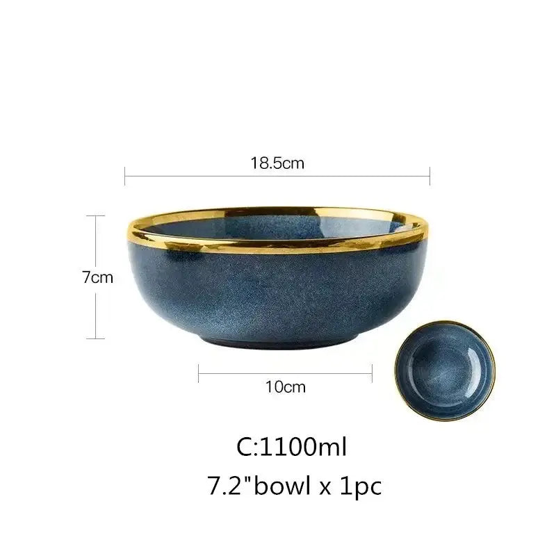 A deep blue gradient ceramic plate set with a glossy speckled finish and polished gold rim for dining room use