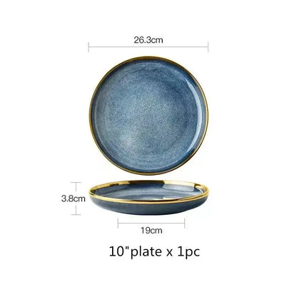 A sleek 10-inch blue gradient ceramic plate with textured glaze and refined gold rim from a ceramic plate set