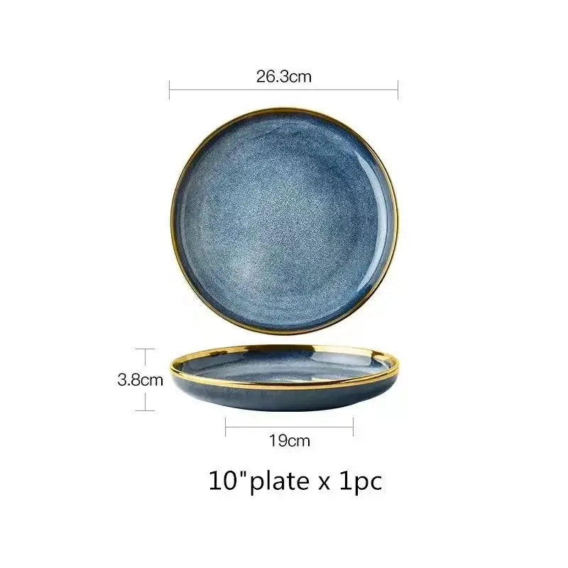 A sleek 10-inch blue gradient ceramic plate with textured glaze and refined gold rim from a ceramic plate set
