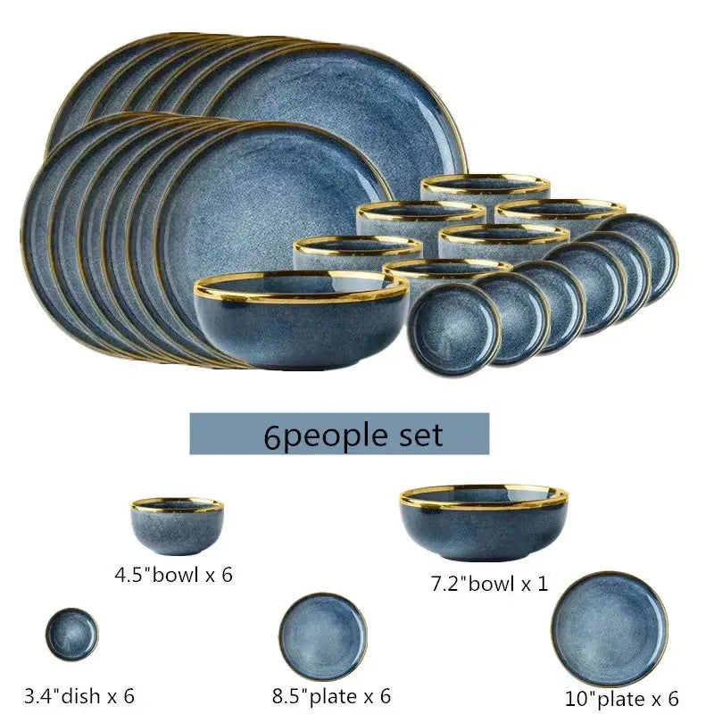 Blue gradient ceramic plate set with gold rims featuring plates bowls and a dish for elegant dining use