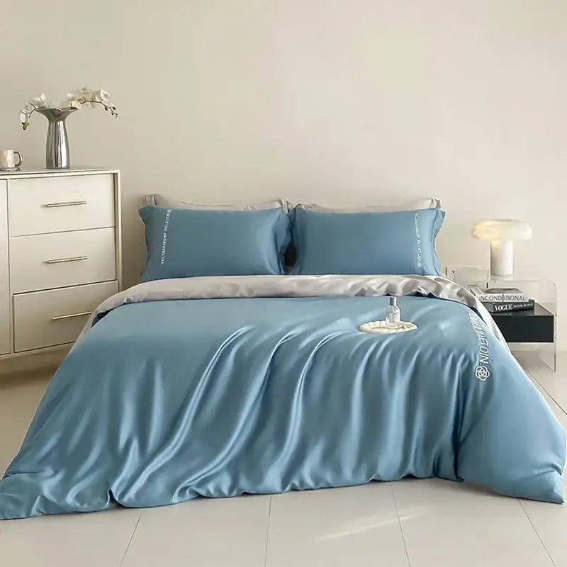 Blue and gray cotton solid bedding set with blue satin duvet cover and embroidered decorbites cotton solid pillowcases