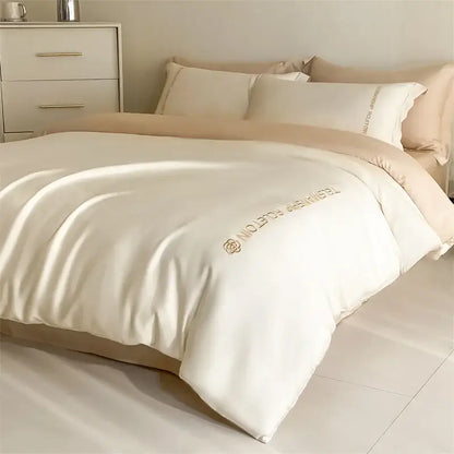 Cream-colored satin duvet cover with gold rose logo embroidery from decorbites cotton solid color bedding set