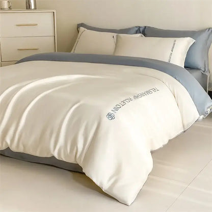 Cream-colored satin duvet cover with subtle gray border and embroidered brand logo from decorbites cotton solid bedding set
