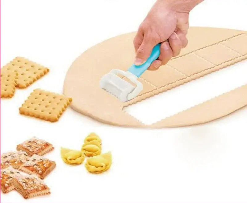 Blue and gray plastic decorbites dough cutter and dumpling maker with handle slicing dough on wooden board