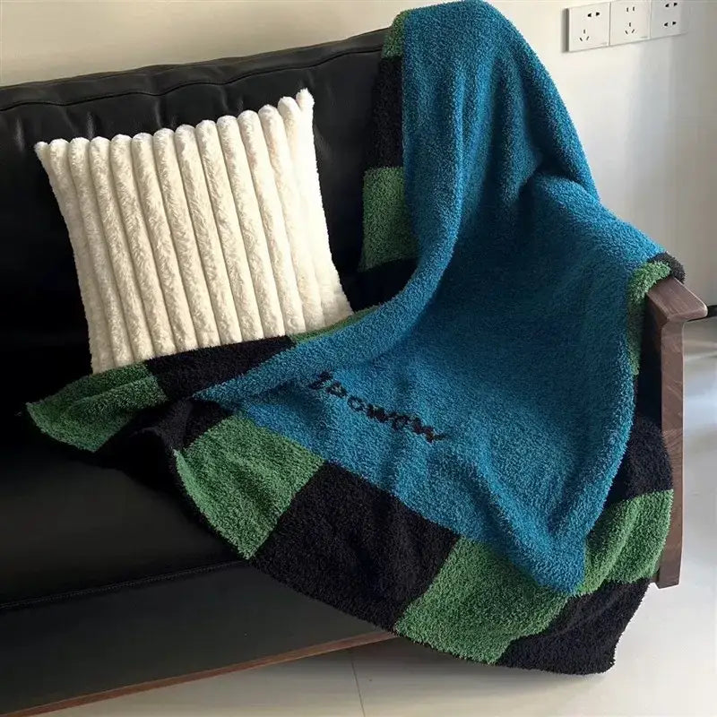 Cozy teal green and black momochi flannel sofa blanket with textured terry cloth finish for decorbites cozy use