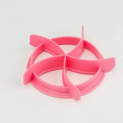 Pink plastic circular cookie cutter with four petal extensions for blue honeycomb and star oval bread molds baking tool