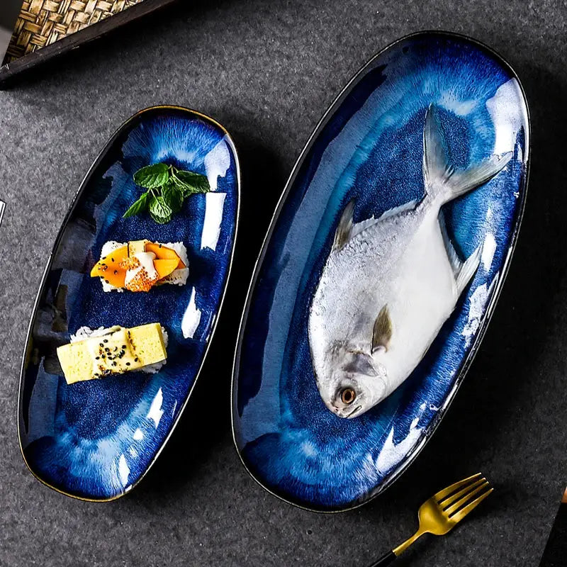 Elegant blue kiln glazed oval ceramic sushi plate with gold trim by decorbites featuring a whole fish