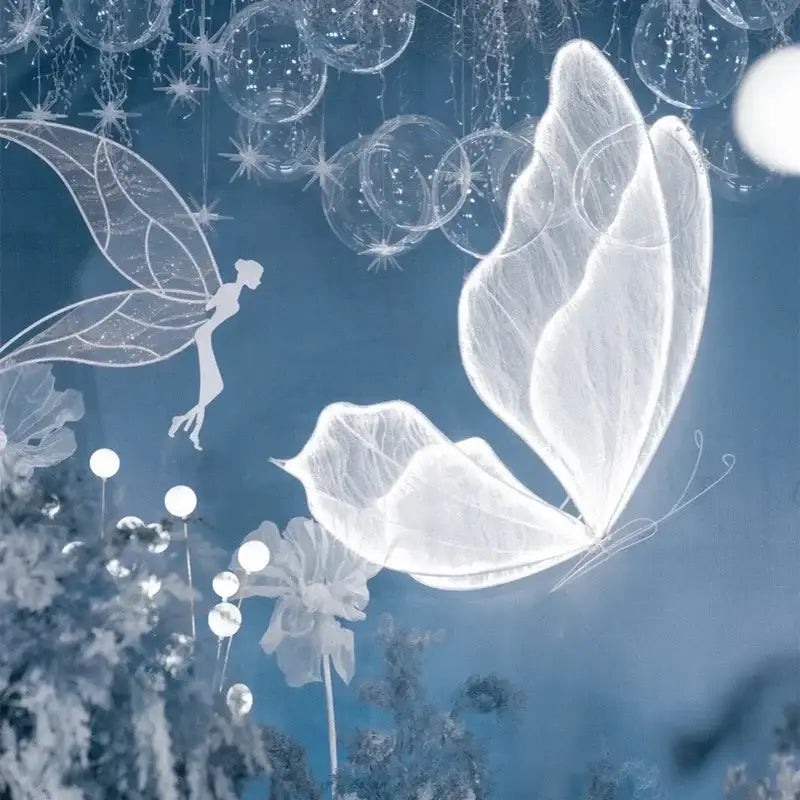 A translucent white lace led butterfly with delicate glowing wings floating against a cool blue decorbites blue lace backdrop