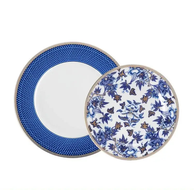 Blue lotus dinnerware featuring blue and white porcelain plates with intricate floral patterns and gold-trimmed edges by decorbites blue