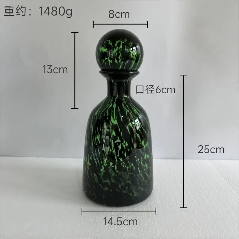 Glossy black glass decanter with vibrant green marbled leopard print stopper for decorbites leopard print living room decor