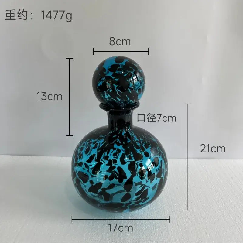 Glossy blue and black marbled glass decanter with spherical stopper for decorbites leopard print glass vase decor