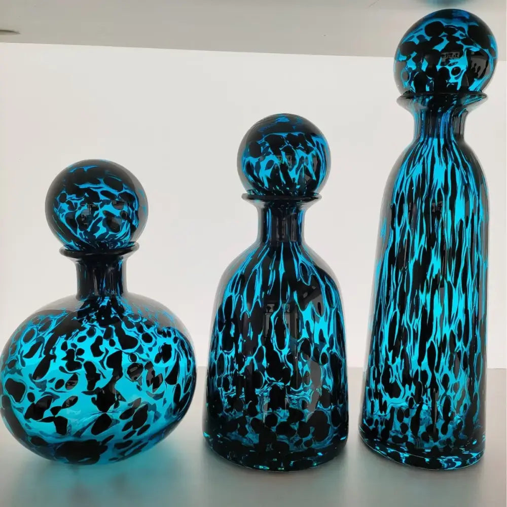 Three vibrant blue marbled leopard print glass vase decanters with spherical stoppers for living room decorbites decor