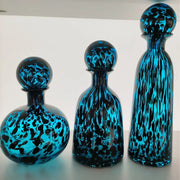 Three vibrant blue marbled leopard print glass vase decanters with spherical stoppers for living room decorbites decor