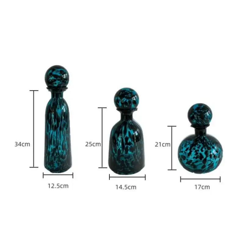 Set of three teal and black marbled glass decorative bottles with spherical stoppers for decorbites leopard print decor