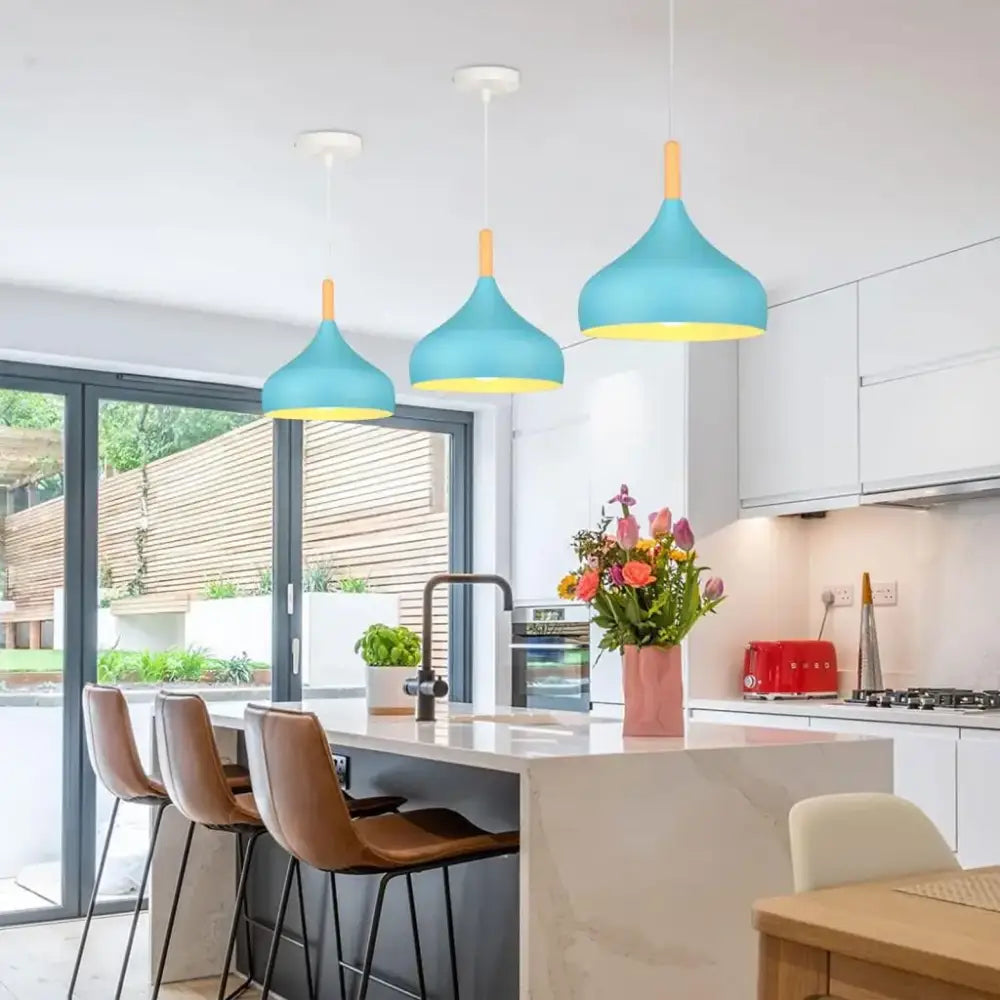 Three decorbites blue nordic pendant lights with matte turquoise metal shades yellow interiors and wooden accents for kitchens