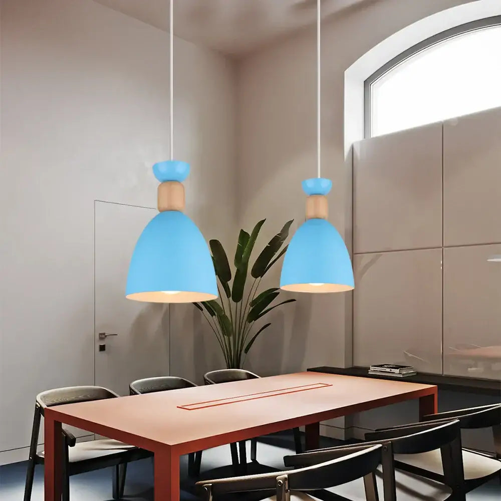 Two light blue matte metal pendant lights with wooden accents hang from the ceiling for kitchen decorbites blue nordic decor