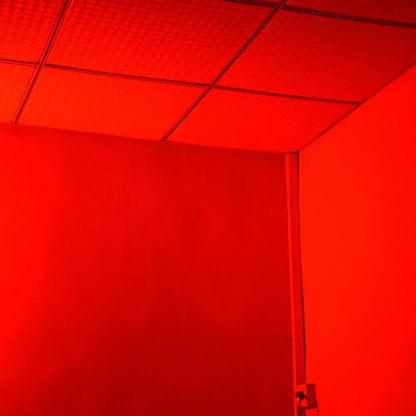 Blue metallic 20w rgb strobe lights illuminating a red-tinted ceiling with square panels and grid lines in a party room