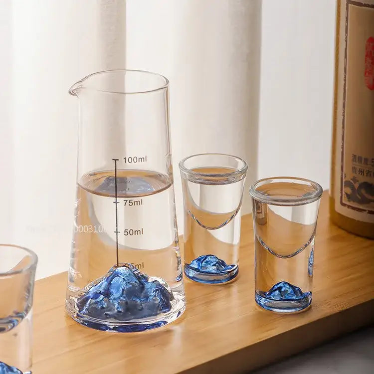 Clear glass decorbites blue sake ice jug set with blue mountain base and matching blue sake glass shot glasses