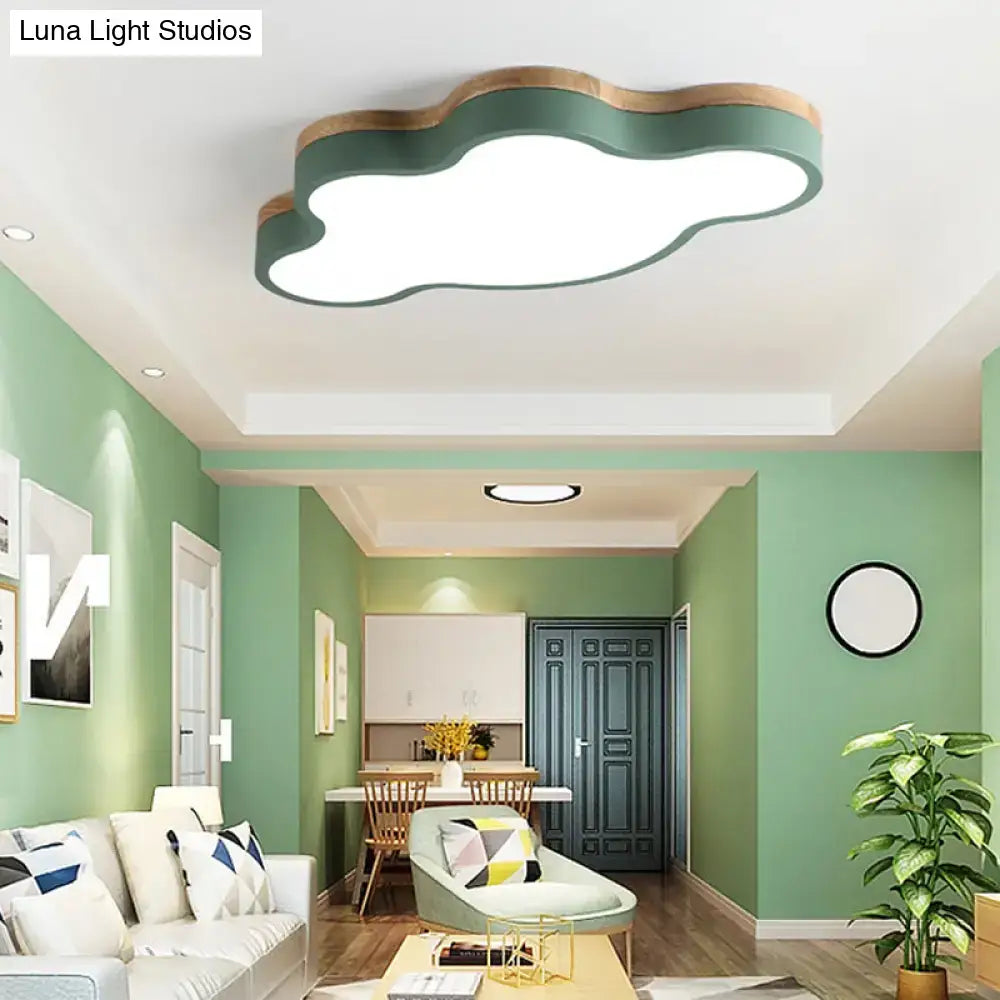 Modern flush mount ceiling lamp with matte green cloud shape and wooden trim for kids bedroom lighting