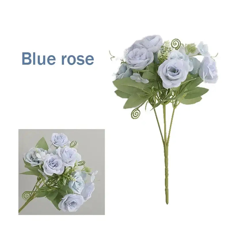 A delicate bouquet of light blue silk fake flowers featuring blue peony tea rose with green leaves and spiral accents