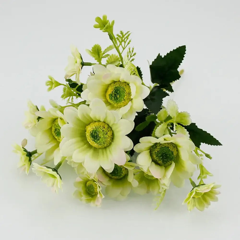 A delicate bouquet of silk fake flowers featuring white and pale green daisies with vibrant yellow centers for home decor